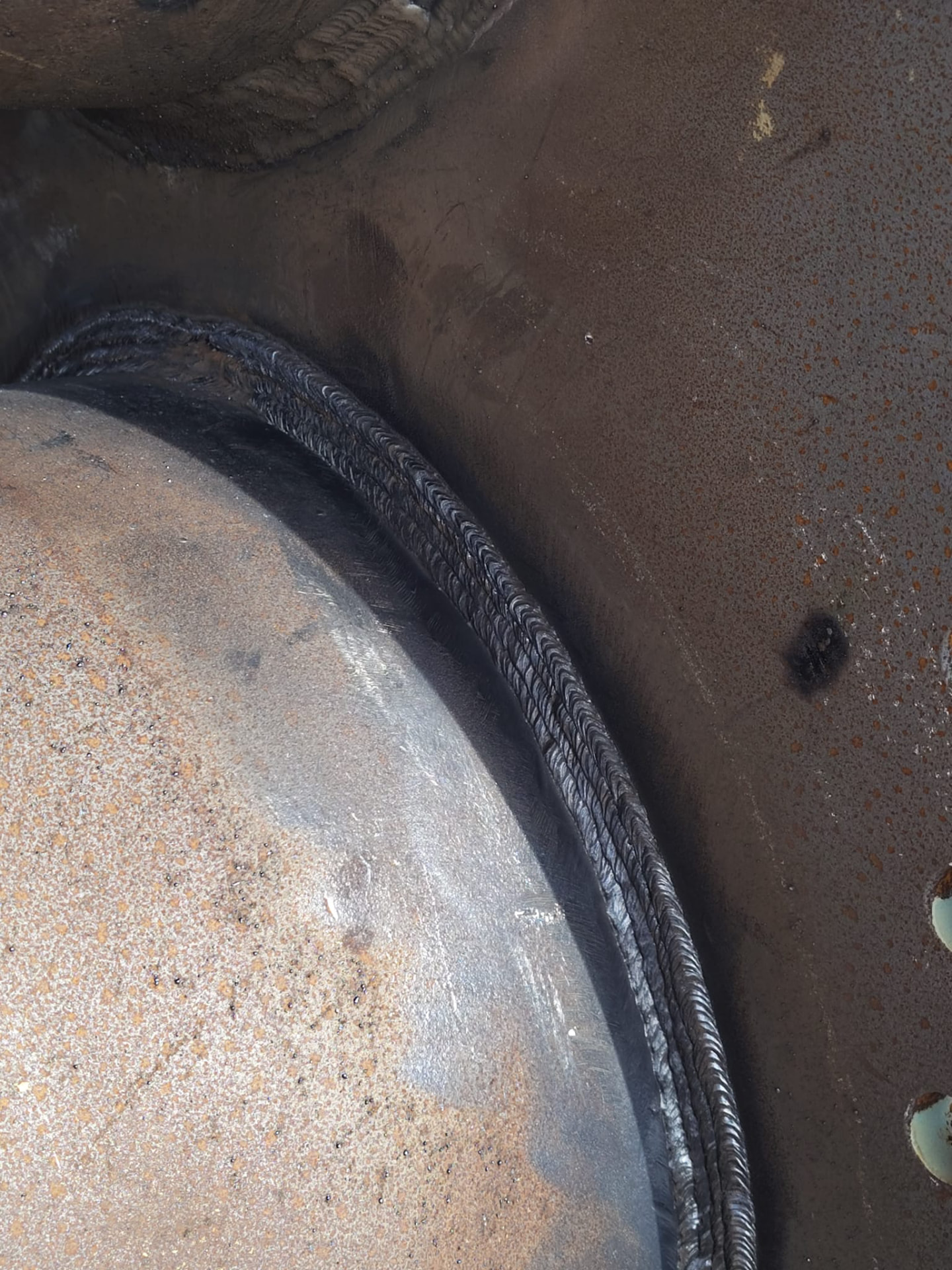 Weld cap on a large-diameter carbon steel pipe